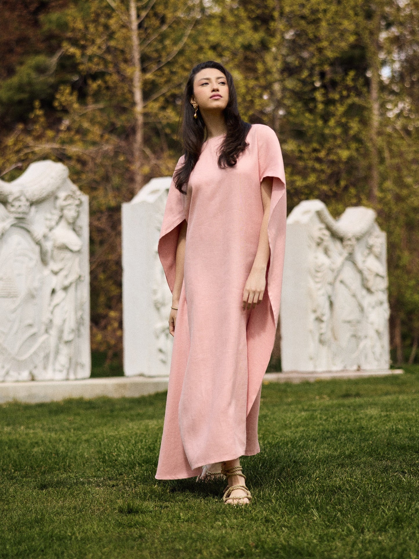 Model wearing a Diana linen cape caftan in pink rose.