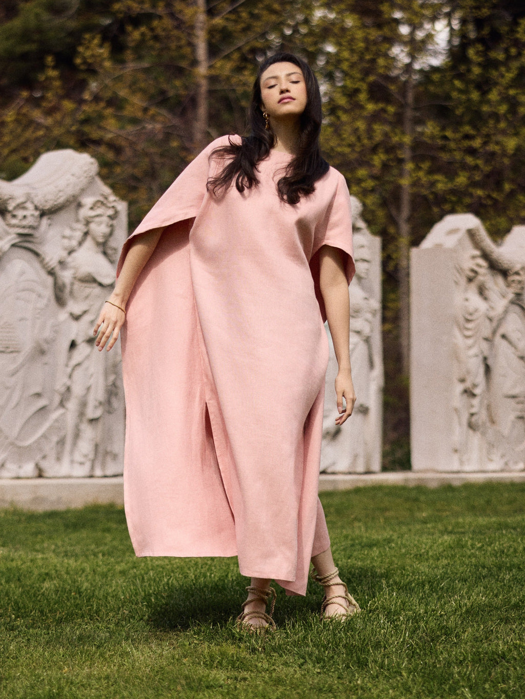 Model wearing a Diana linen cape caftan in pink rose.